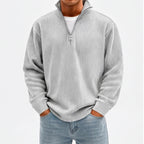 Model wearing Light Gray corduroy pullover in a studio