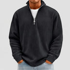 Model wearing Black corduroy pullover in a studio
