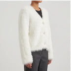 Model wearing white thicken knitted cardigan in a studio - 2