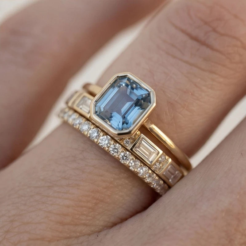 Model wearing Lumière Gold & Sapphire Ring Set Lumière Gold & Sapphire Ring Set close-up - 4