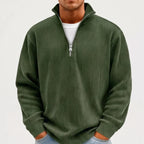 Model wearing Dark Green corduroy pullover in a studio
