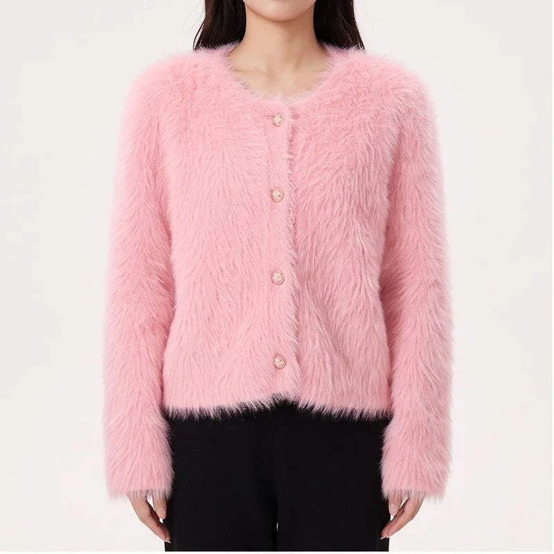 Model wearing Pink cashmere cardigan in a studio