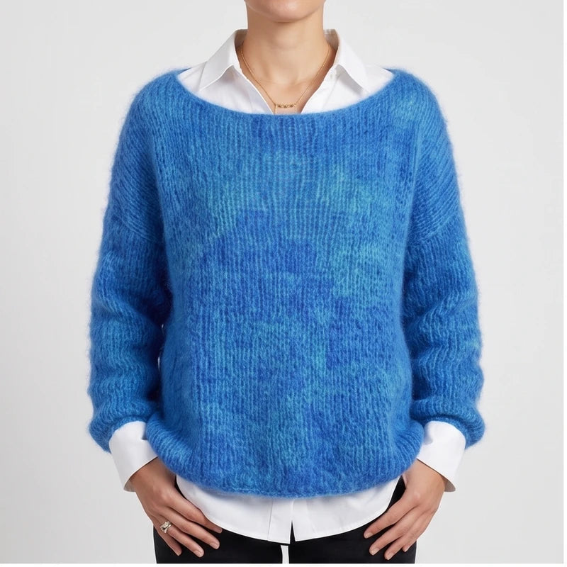 Model wearing dark blue knit pullover in a studio