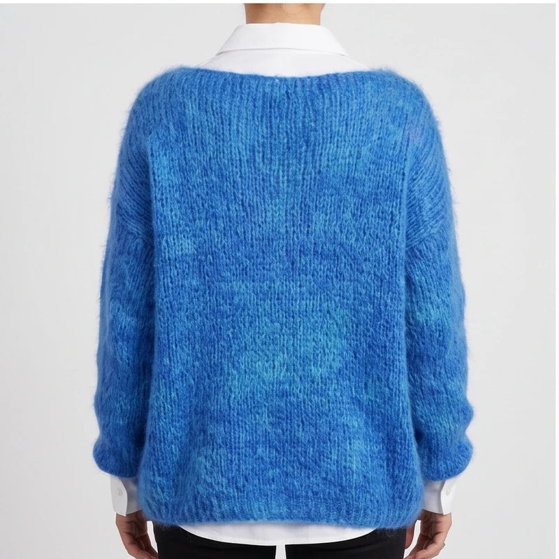 Model wearing dark blue knit pullover in a studio - 2