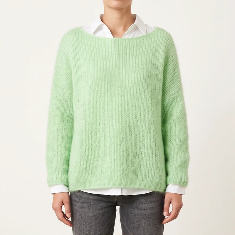 Model wearing green knit pullover in a studio