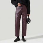 Burgundy leather pants on an off-gray studio background - 2