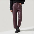 Burgundy leather pants on an off-gray studio background - 3