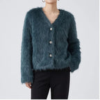 Model wearing black knitted cardigan in a studio