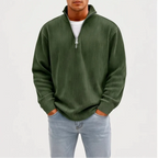 Model wearing Dark Green corduroy pullover in a studio - 2