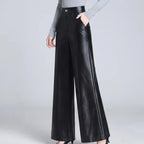 Black leather pants on an off-gray studio background - 2