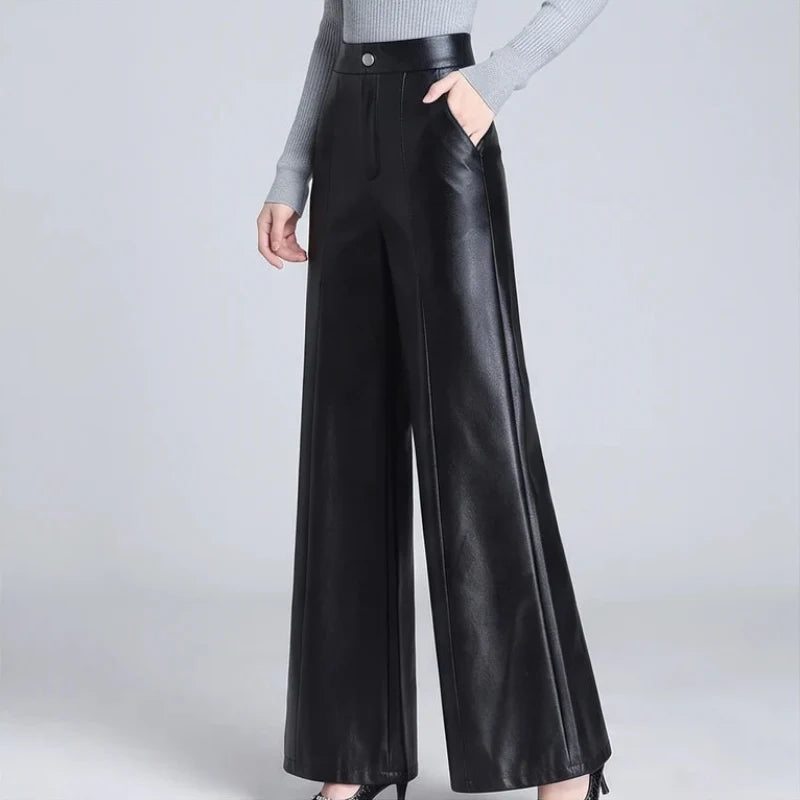 Black leather pants on an off-gray studio background - 2