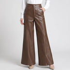 Coffee leather pants on an off-gray studio background - 2