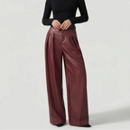 Red leather pants on an off-gray studio background - 2