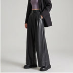 Black leather pants on an off-gray studio background - 2