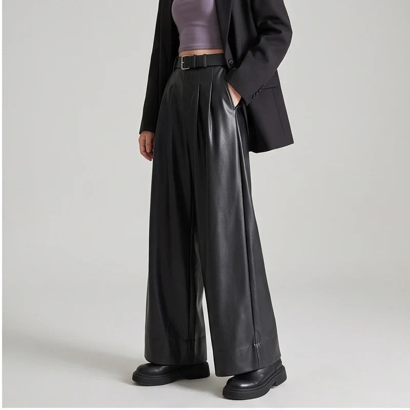 Black leather pants on an off-gray studio background - 2