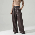 Coffee leather pants on an off-gray studio background - 2