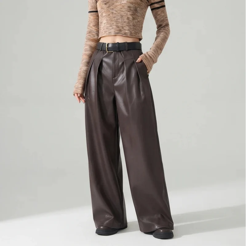 Coffee leather pants on an off-gray studio background - 2