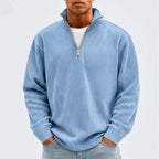Model wearing Blue corduroy pullover in a studio