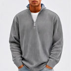 Model wearing Gray corduroy pullover in a studio