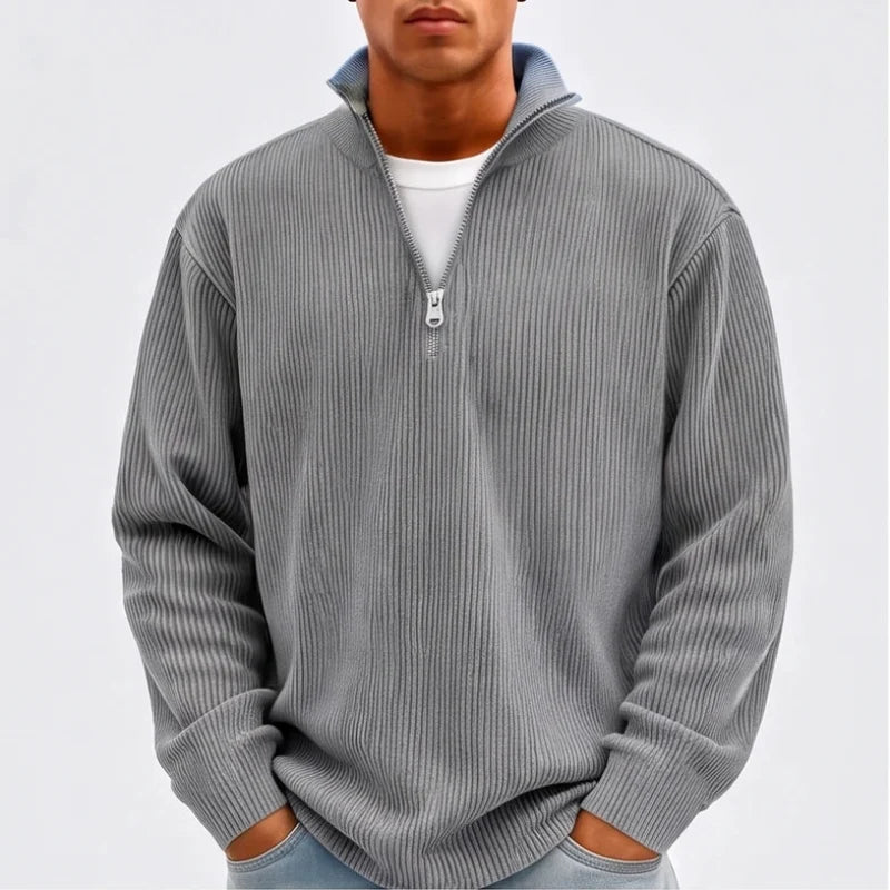 Model wearing Gray corduroy pullover in a studio