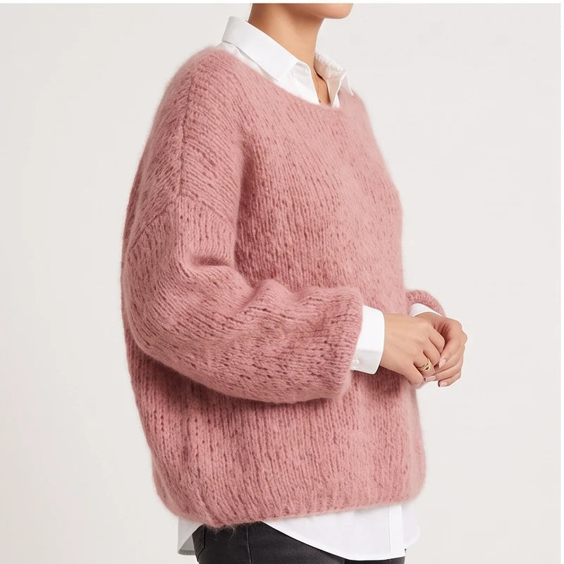 Model wearing pink knit pullover in a studio - 2