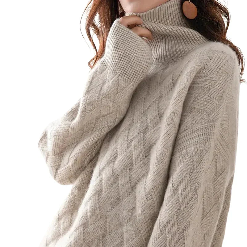 Woman wearing a cream cable-knit turtleneck sweater with a woven diagonal pattern, holding the high ribbed collar.