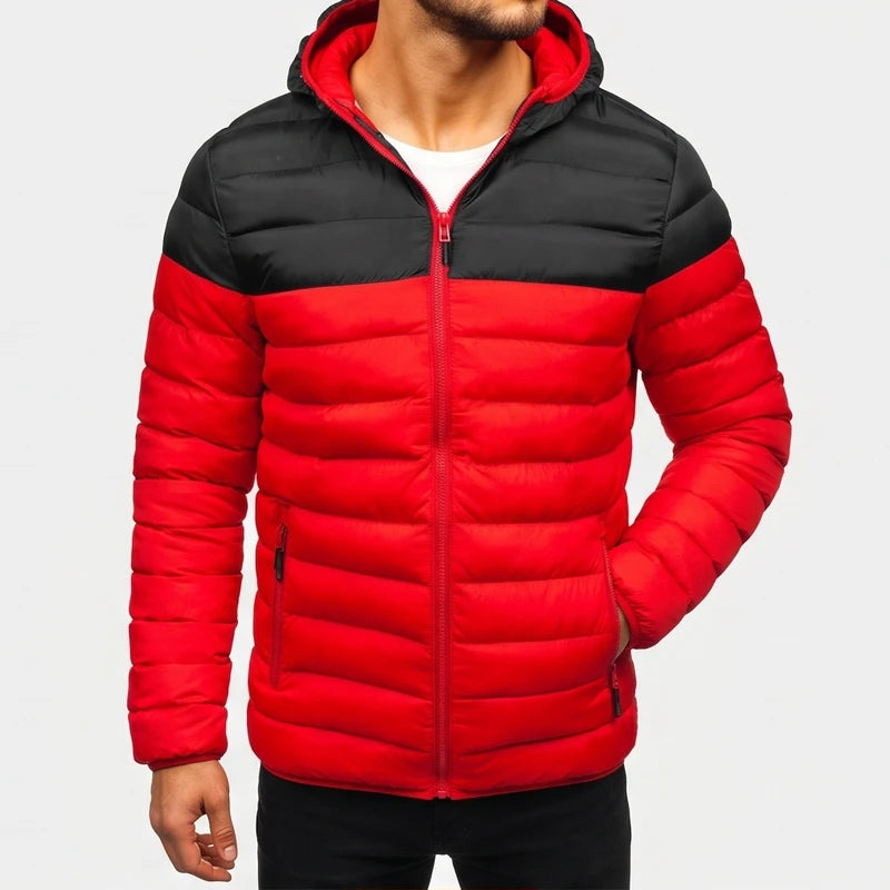 Man wearing a red and black color-block puffer jacket with a hood, red zipper, and side pockets.