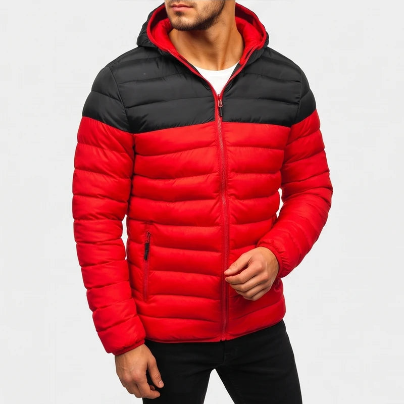 Man wearing a red and black two-tone hooded puffer jacket with a visible zipper over a white t-shirt.