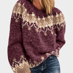 Woman wearing a fuzzy plum knit sweater with a tan and white fair isle pattern over blue jeans.