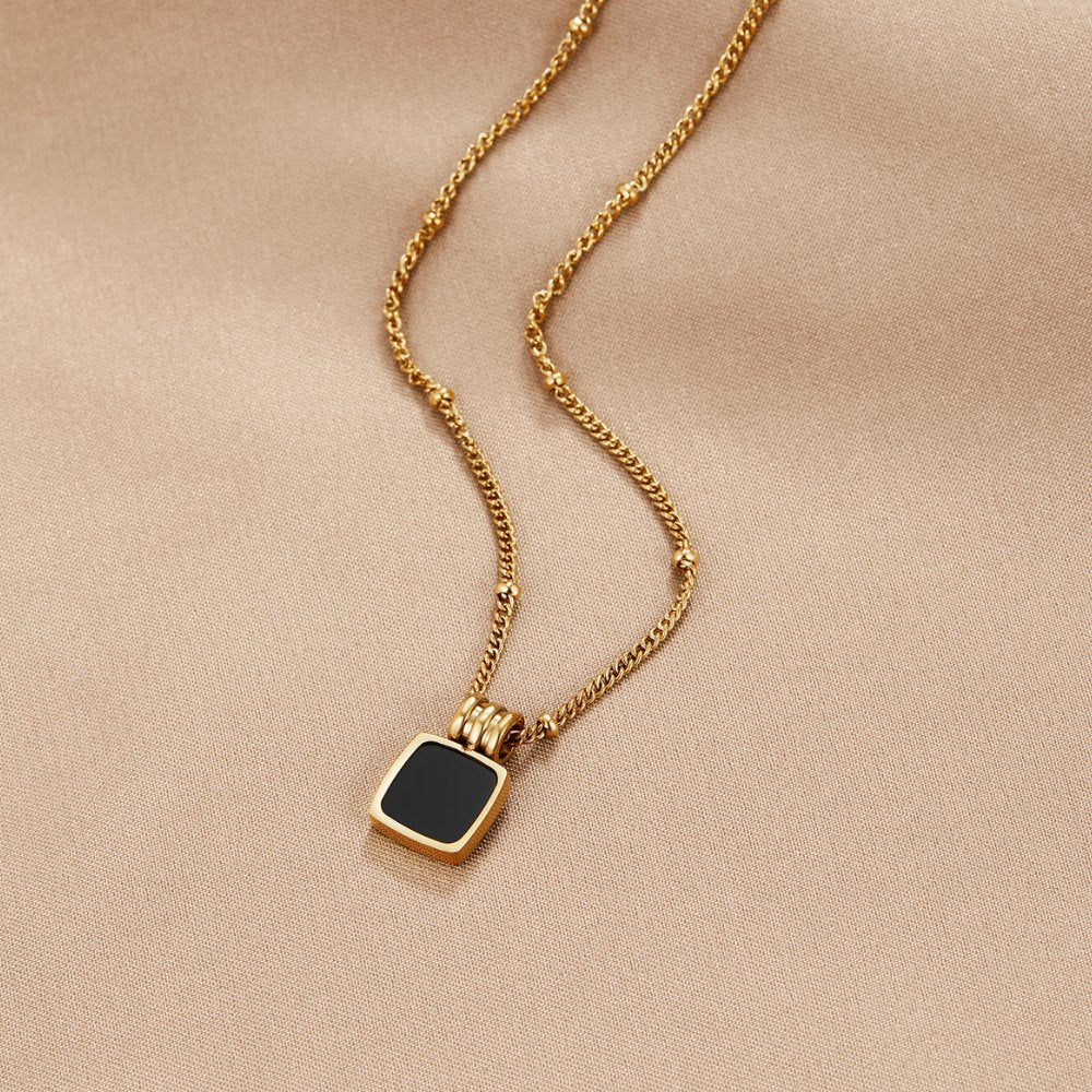 Solenne Gold Tone Black Stone Pendant Necklace