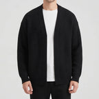 Black knit cardigan on an off-gray studio background - 2