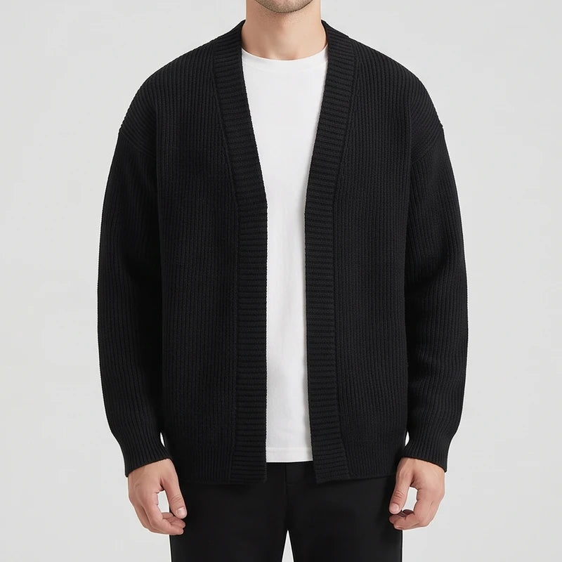 Black knit cardigan on an off-gray studio background - 2
