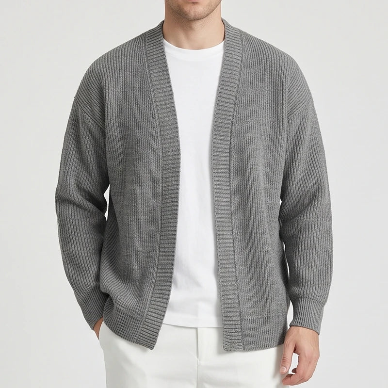 Gray knit cardigan on an off-gray studio background