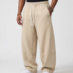 Beige apparel on an off-gray studio background