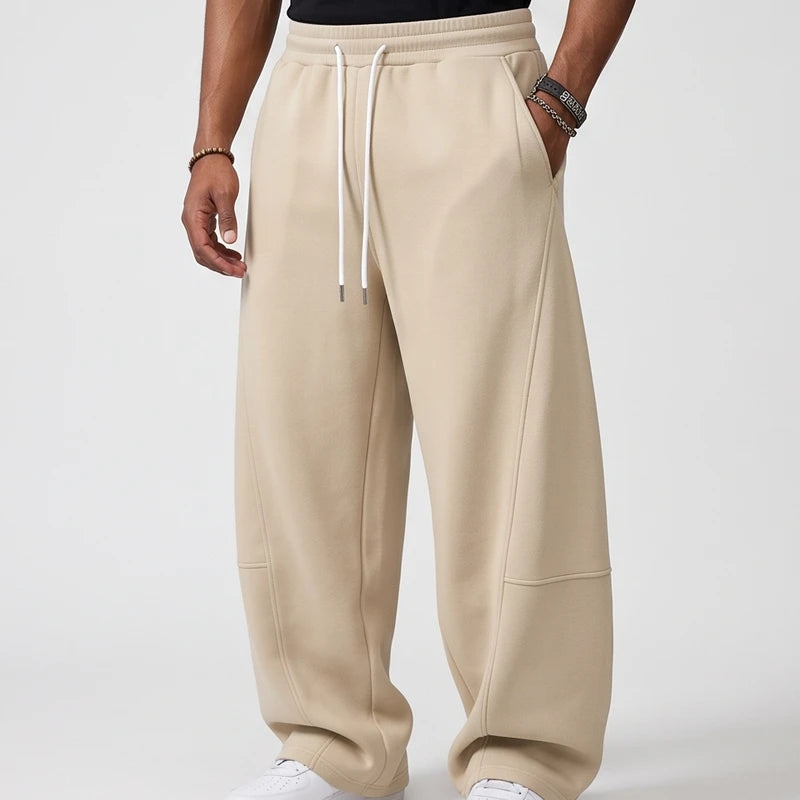 Beige apparel on an off-gray studio background