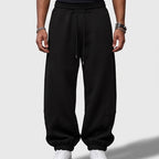 Black apparel on an off-gray studio background - 2