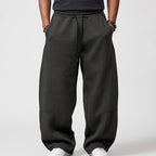 Dark Grey apparel on an off-gray studio background
