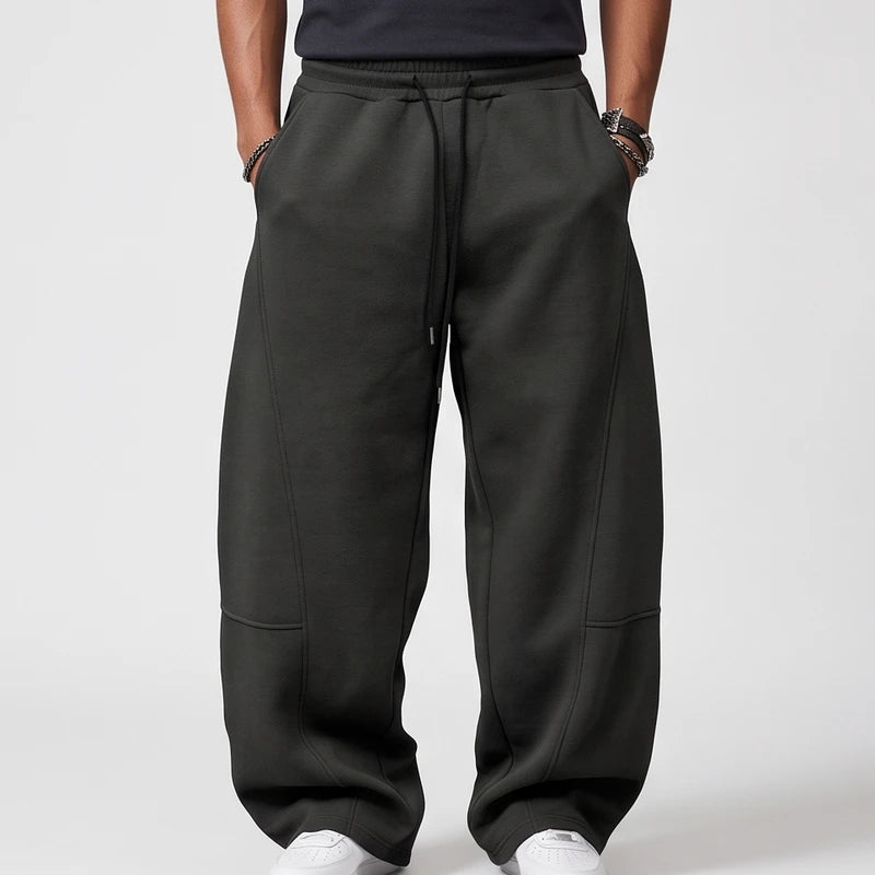 Dark Grey apparel on an off-gray studio background