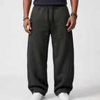 Dark Grey apparel on an off-gray studio background - 2