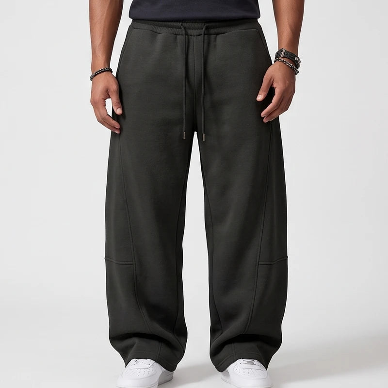 Dark Grey apparel on an off-gray studio background - 2