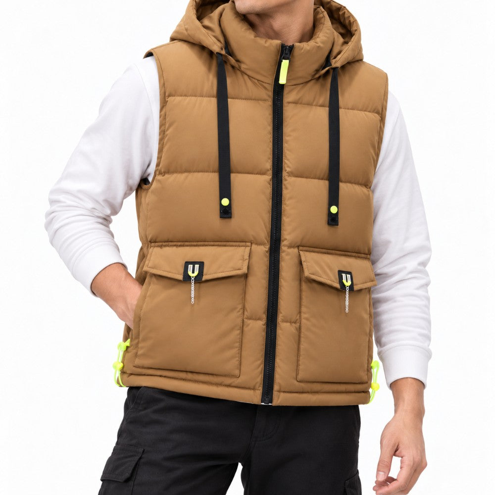 Man wearing a brown hooded puffer vest with black zippers, neon yellow accents, and two flap pockets over a white long-sleeve shirt.