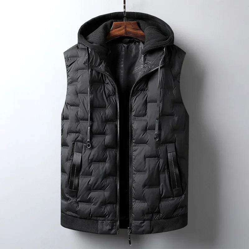 Black quilted puffer vest with a dark grey knit hooded insert and side pockets, hanging on a wooden hanger.