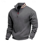 Dark grey quarter-zip top with a stand-up collar, prominent silver zipper, and red and white striped detailing on the inner collar.