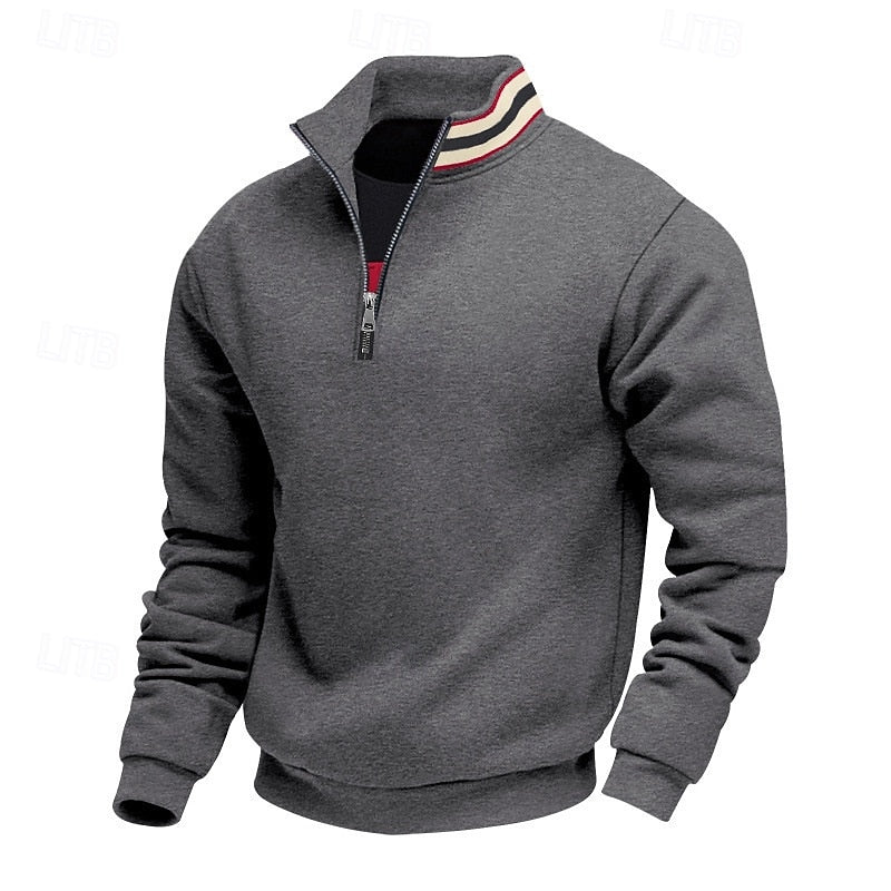 Dark grey quarter-zip top with a stand-up collar, prominent silver zipper, and red and white striped detailing on the inner collar.