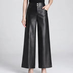 Black leather pants on an off-gray studio background - 2