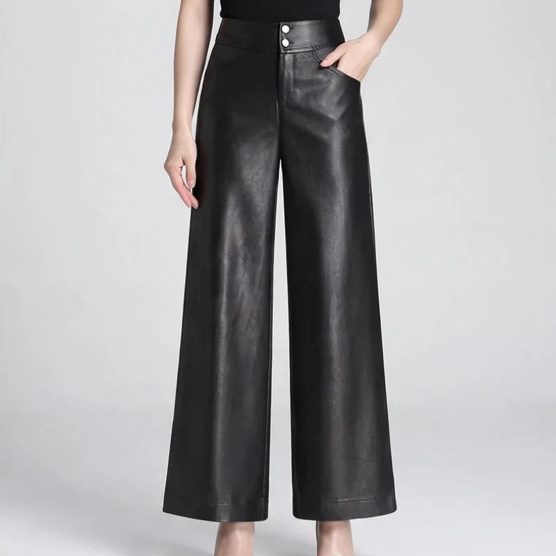 Black leather pants on an off-gray studio background - 2