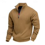 Tan quarter-zip sweatshirt with a standing collar, visible black undershirt, and a silver zipper pull on a white background.