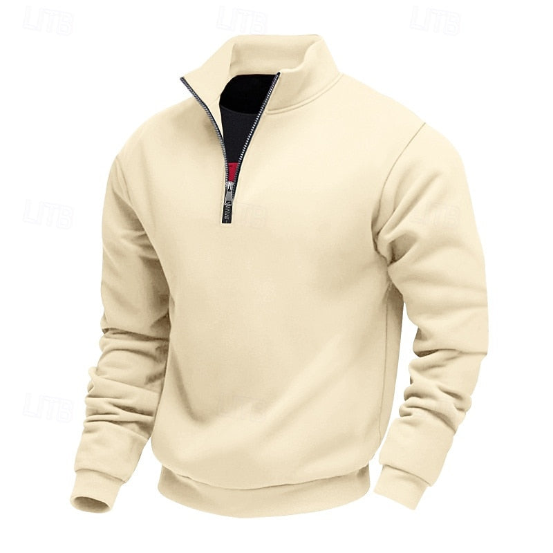 Cream quarter-zip sweatshirt with a black zipper, high collar, and ribbed cuffs and hem, presented on a white background.