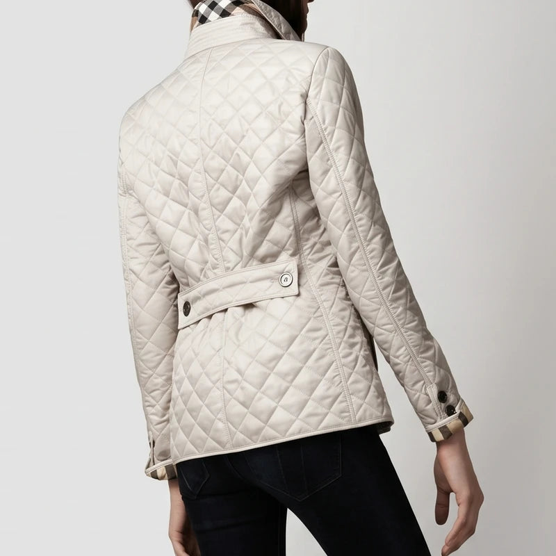 Blue jacket on an off-gray studio background