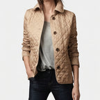 Khaki jacket on an off-gray studio background